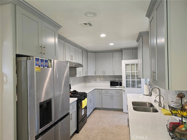 15768 Amar Rd, La Puente, CA 91744 - kitchen with appliances with stainless steel finishes, under cabinet range hood, gray cabinets, light countertops, and recessed lighting