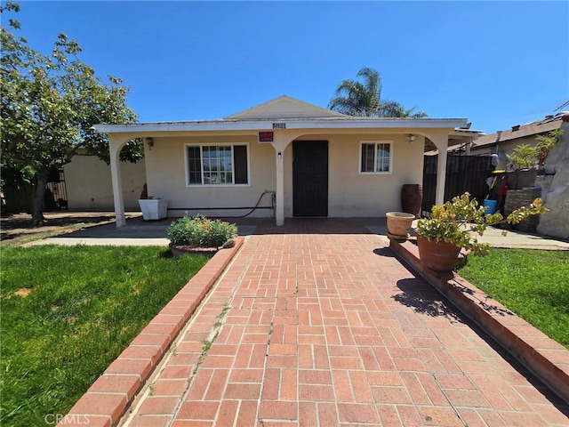 15768 Amar Rd, La Puente, CA 91744 - ranch-style house with stucco siding and a patio