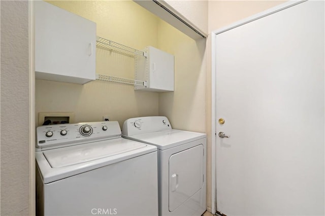 27812 Ruggie Rd, Menifee, CA 92585 - washroom featuring washing machine and dryer and cabinet space