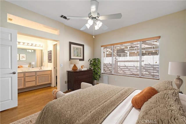 27812 Ruggie Rd, Menifee, CA 92585 - bedroom with wood finished floors, ensuite bathroom, and a ceiling fan