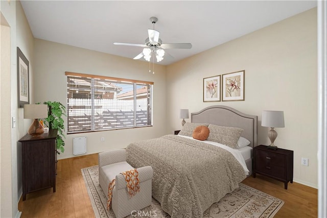 27812 Ruggie Rd, Menifee, CA 92585 - bedroom with light wood finished floors and ceiling fan