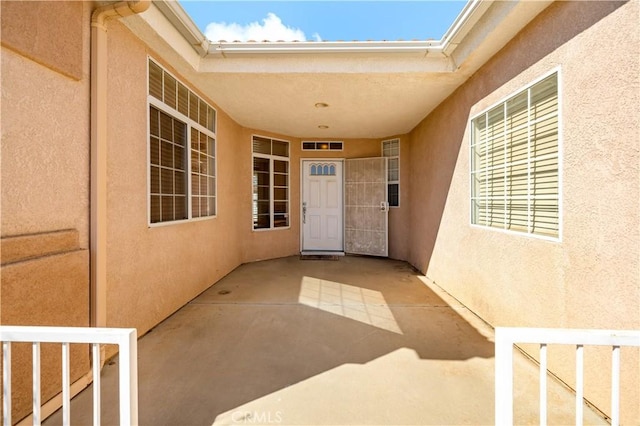 27812 Ruggie Rd, Menifee, CA 92585 - property entrance featuring stucco siding and a patio