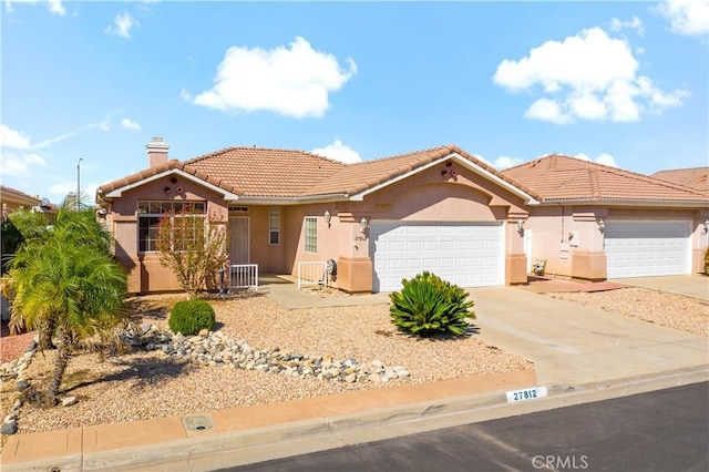 27812 Ruggie Rd, Menifee, CA 92585 - mediterranean / spanish-style house with stucco siding, a tiled roof, a garage, and a chimney