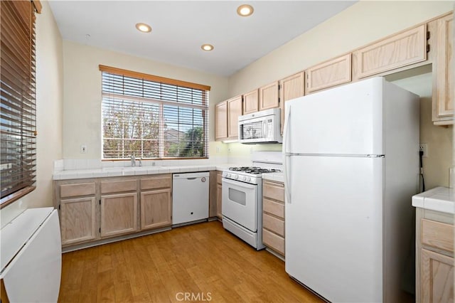 27812 Ruggie Rd, Menifee, CA 92585 - kitchen with white appliances, tile countertops, light brown cabinets, light wood-type flooring, and recessed lighting