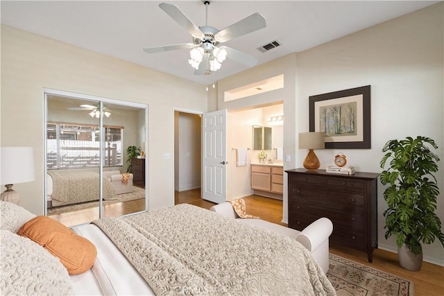 27812 Ruggie Rd, Menifee, CA 92585 - bedroom with light wood-type flooring, ceiling fan, a closet, and ensuite bathroom