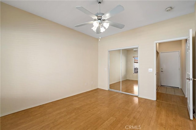 27812 Ruggie Rd, Menifee, CA 92585 - unfurnished bedroom with light wood finished floors, a closet, and ceiling fan