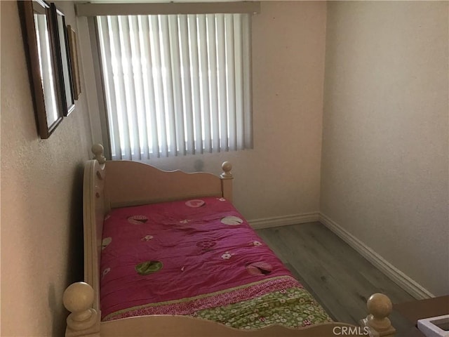 9144 Oakleaf Ct, Hesperia, CA 92344 - bedroom with wood finished floors and multiple windows