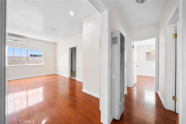 2047 Delford Ave, Duarte, CA 91010 - corridor with a heating unit, wood finished floors, a wall mounted AC, and recessed lighting