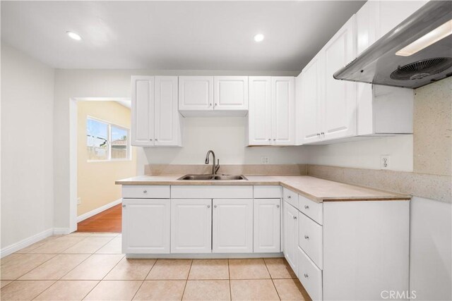 2047 Delford Ave, Duarte, CA 91010 - kitchen with wall chimney exhaust hood, light tile patterned floors, light countertops, white cabinets, and recessed lighting