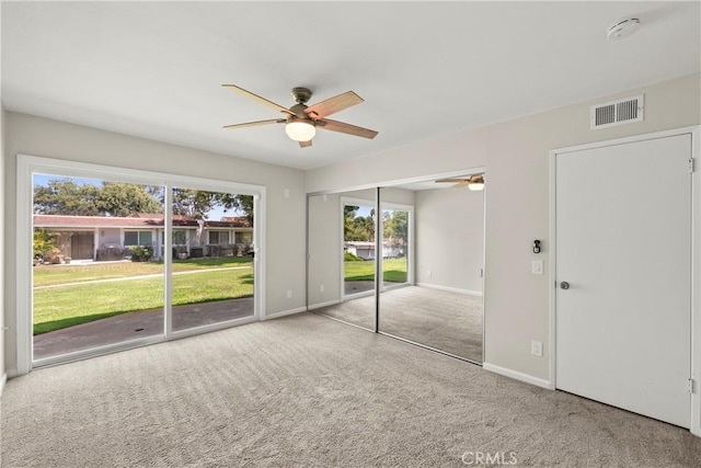 22271 Caminito Danubo, Laguna Hills, CA 92653 - unfurnished bedroom with access to outside, multiple windows, carpet, and ceiling fan