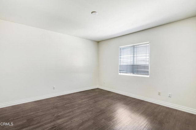 4069 Bristlecone Pine Ln, San Bernardino, CA 92407 - spare room with dark wood-style flooring and baseboards