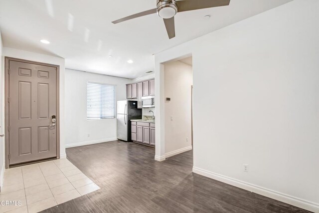 4069 Bristlecone Pine Ln, San Bernardino, CA 92407 - unfurnished living room featuring ceiling fan, wood finished floors, and recessed lighting