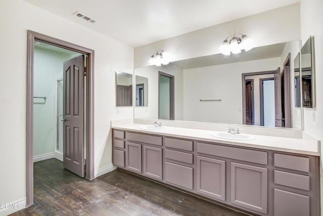 4069 Bristlecone Pine Ln, San Bernardino, CA 92407 - full bath featuring double vanity and wood finished floors