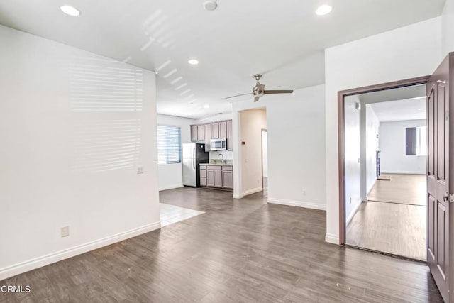4069 Bristlecone Pine Ln, San Bernardino, CA 92407 - unfurnished living room featuring a ceiling fan, wood finished floors, and recessed lighting