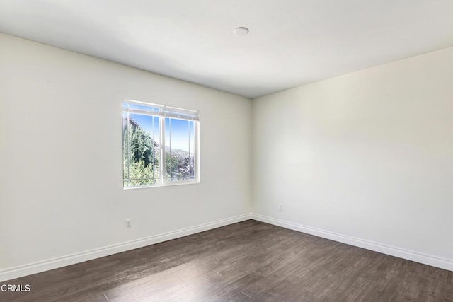 4069 Bristlecone Pine Ln, San Bernardino, CA 92407 - spare room with dark wood finished floors and baseboards