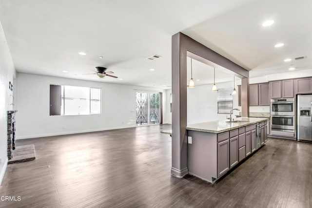 4069 Bristlecone Pine Ln, San Bernardino, CA 92407 - kitchen with gray cabinetry, stainless steel appliances, dark wood-type flooring, and recessed lighting