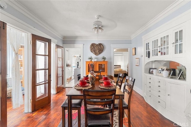 841 Cherry Ave, Long Beach, CA 90813 - dining space featuring ceiling fan, dark wood-style flooring, and crown molding
