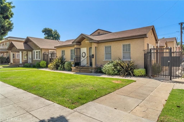 841 Cherry Ave, Long Beach, CA 90813 - bungalow featuring stucco siding, a gate, and a front lawn