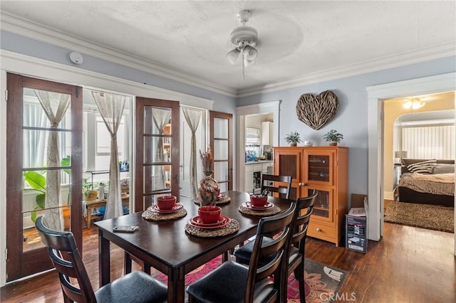 841 Cherry Ave, Long Beach, CA 90813 - dining room with ceiling fan, dark wood-type flooring, healthy amount of natural light, and crown molding