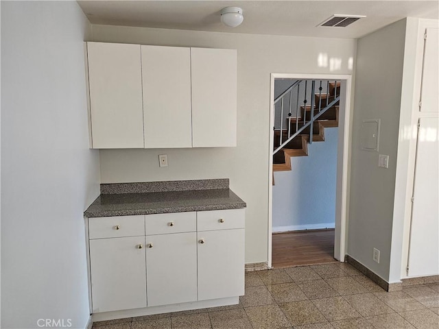 6801 Mammoth Ave Unit 6, Van Nuys, CA 91405 - kitchen featuring dark countertops, white cabinets, and granite floors