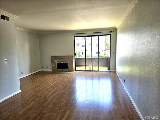 6801 Mammoth Ave Unit 6, Van Nuys, CA 91405 - unfurnished living room featuring ornamental molding, a textured wall, dark wood-style flooring, and a fireplace with flush hearth