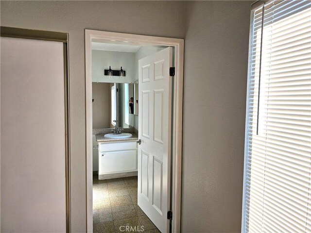 6801 Mammoth Ave Unit 6, Van Nuys, CA 91405 - corridor with a sink and granite floors