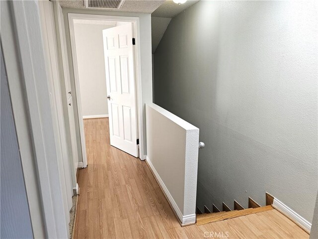 6801 Mammoth Ave Unit 6, Van Nuys, CA 91405 - hall featuring an upstairs landing and wood finished floors