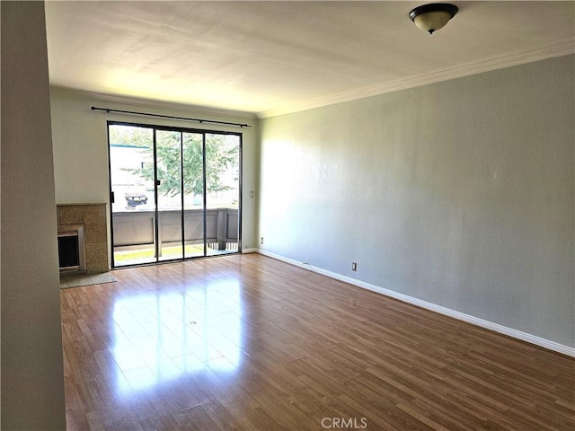 6801 Mammoth Ave Unit 6, Van Nuys, CA 91405 - empty room featuring wood finished floors, ornamental molding, and a fireplace with flush hearth