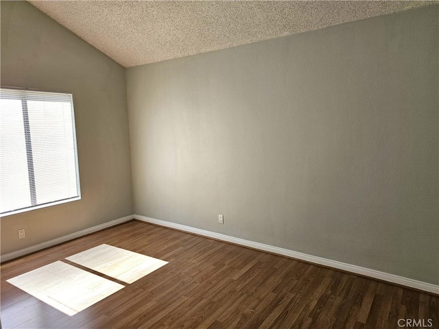 6801 Mammoth Ave Unit 6, Van Nuys, CA 91405 - spare room with dark wood-style floors, lofted ceiling, and a textured ceiling