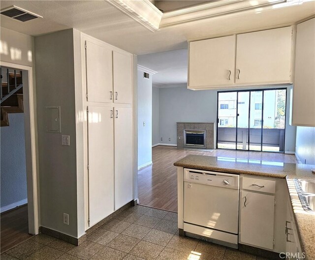 6801 Mammoth Ave Unit 6, Van Nuys, CA 91405 - kitchen featuring dishwasher, ornamental molding, white cabinetry, granite floors, and a peninsula