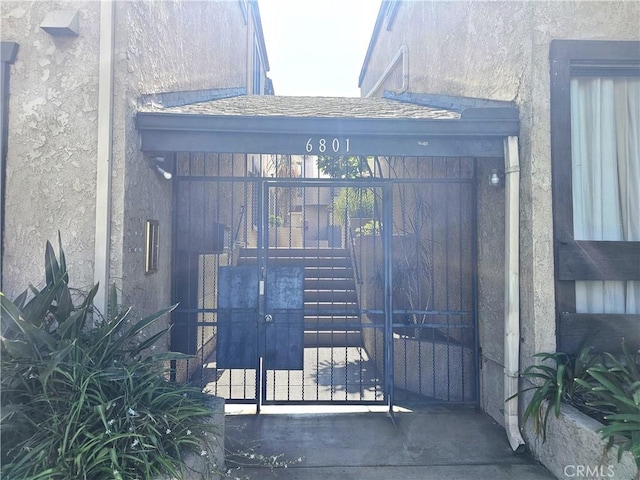 6801 Mammoth Ave Unit 6, Van Nuys, CA 91405 - doorway to property featuring stucco siding and a gate