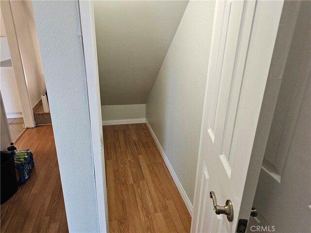 6801 Mammoth Ave Unit 6, Van Nuys, CA 91405 - hallway featuring wood finished floors and vaulted ceiling