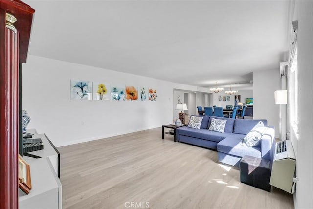 5510 Paseo Del Lago W Unit 2D, Laguna Woods, CA 92637 - living area featuring a chandelier and wood finished floors