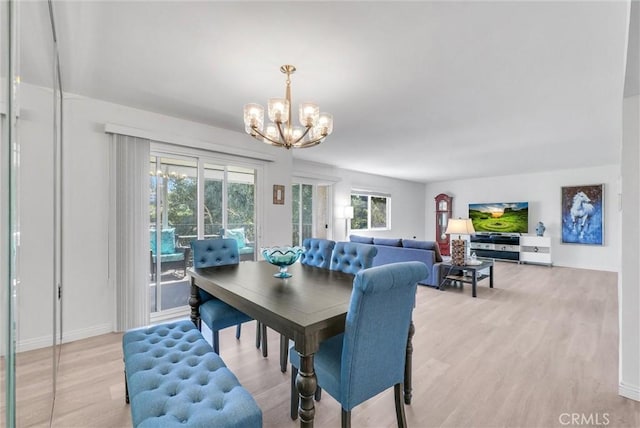 5510 Paseo Del Lago W Unit 2D, Laguna Woods, CA 92637 - dining area with a chandelier and light wood-style floors