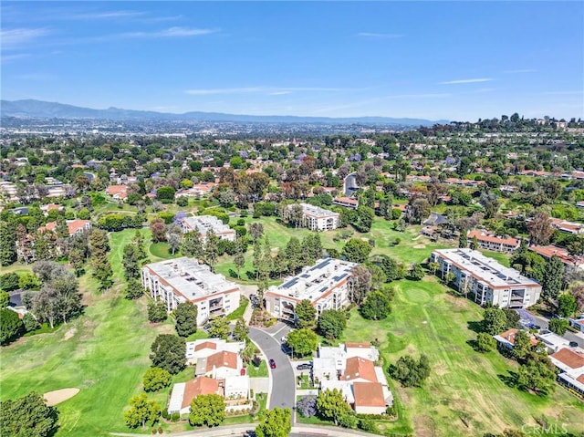 5510 Paseo Del Lago W Unit 2D, Laguna Woods, CA 92637 - drone / aerial view of a local golf course and a mountainous background
