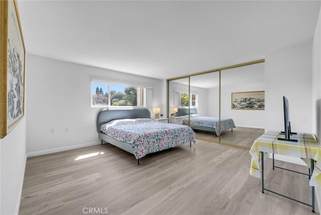 5510 Paseo Del Lago W Unit 2D, Laguna Woods, CA 92637 - bedroom with wood finished floors and a closet