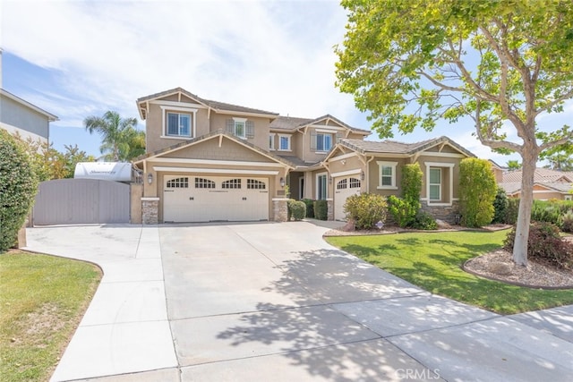 40433 Wgasa Pl, Temecula, CA 92591 - craftsman-style home featuring stone siding, driveway, a front lawn, and a garage