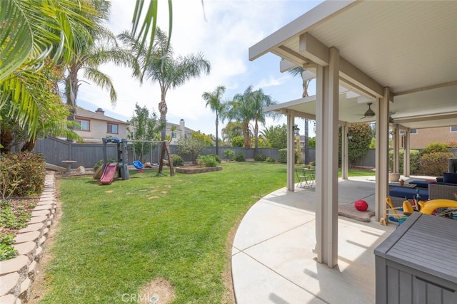 40433 Wgasa Pl, Temecula, CA 92591 - fenced backyard with a playground, a patio area, and a ceiling fan