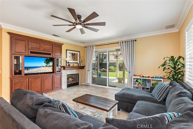 40433 Wgasa Pl, Temecula, CA 92591 - living area with ornamental molding, a ceiling fan, healthy amount of natural light, and a glass covered fireplace