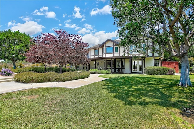 6735 Calais Ct, Riverside, CA 92506 - english style home with stucco siding, a front yard, and french doors