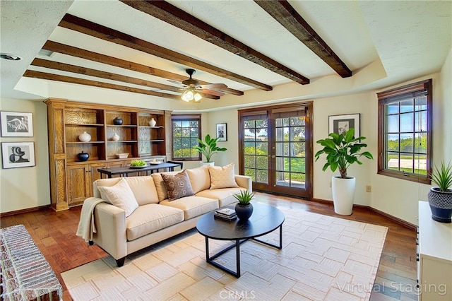 6735 Calais Ct, Riverside, CA 92506 - living area featuring beam ceiling, ceiling fan, and wood finished floors
