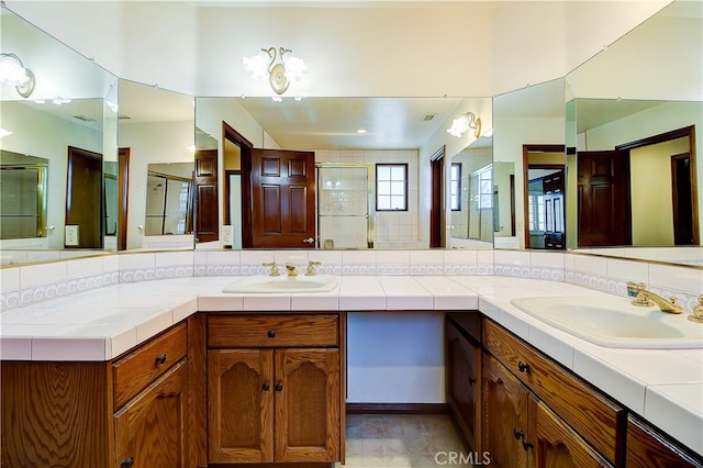 6735 Calais Ct, Riverside, CA 92506 - full bathroom with double vanity, a shower stall, and tasteful backsplash