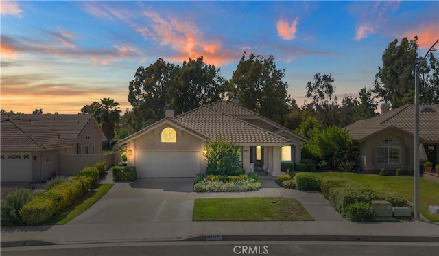 32244 Corte Coronado, Temecula, CA 92592 - view of front of property featuring an attached garage, driveway, a tiled roof, and stucco siding