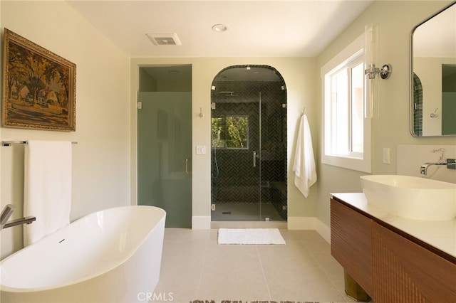 814 E Foothill Blvd, Monrovia, CA 91016 - bathroom featuring healthy amount of natural light, a shower stall, vanity, and a freestanding tub