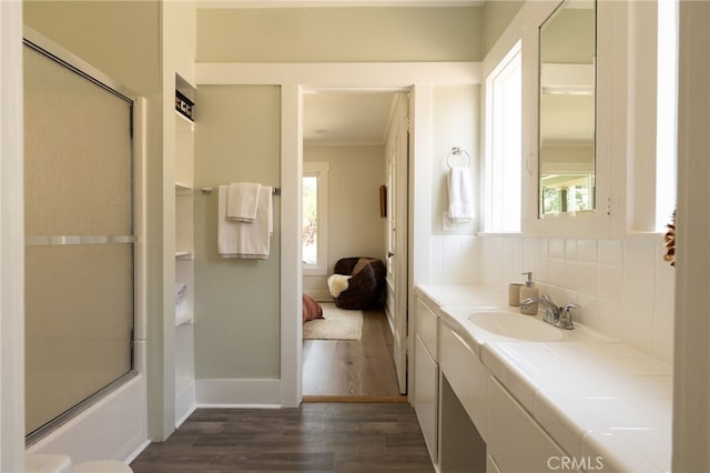 814 E Foothill Blvd, Monrovia, CA 91016 - full bathroom featuring plenty of natural light, wood finished floors, vanity, ornamental molding, and tasteful backsplash