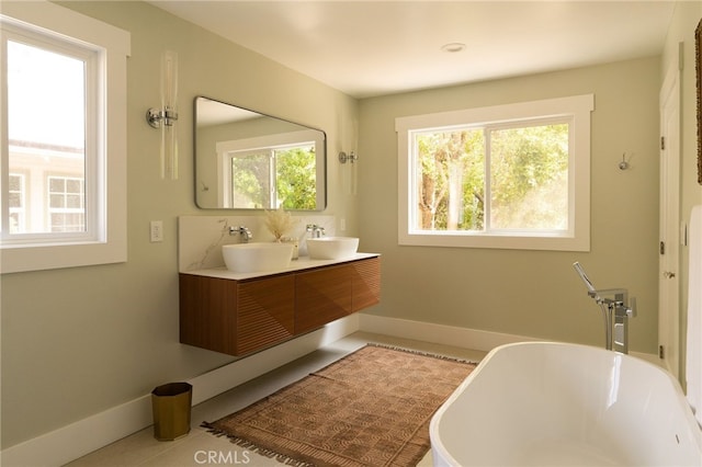 814 E Foothill Blvd, Monrovia, CA 91016 - bathroom featuring a freestanding tub, double vanity, and tile patterned floors