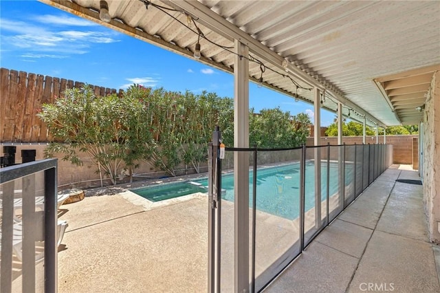 42915 Wisconsin Ave, Palm Desert, CA 92211 - view of pool featuring a patio, a fenced backyard, and a pool with connected hot tub