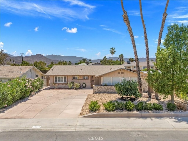 42915 Wisconsin Ave, Palm Desert, CA 92211 - ranch-style home featuring a mountain view and concrete driveway
