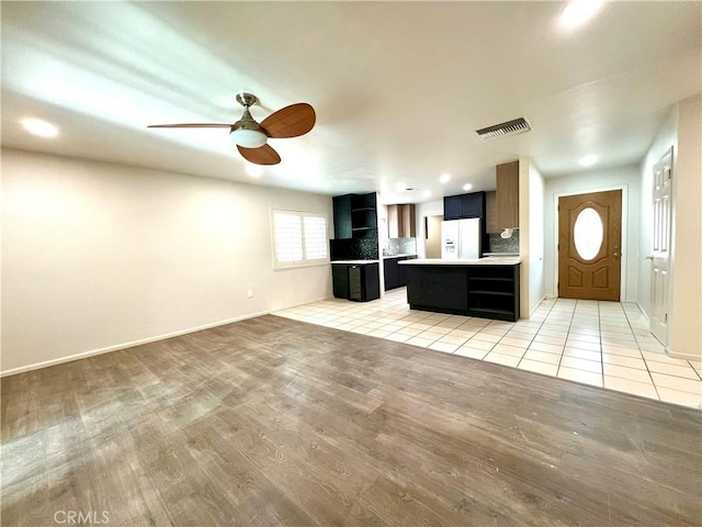 42915 Wisconsin Ave, Palm Desert, CA 92211 - unfurnished living room with light wood finished floors, a ceiling fan, and recessed lighting