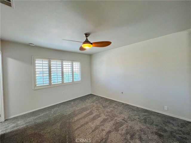 42915 Wisconsin Ave, Palm Desert, CA 92211 - empty room with ceiling fan and dark colored carpet